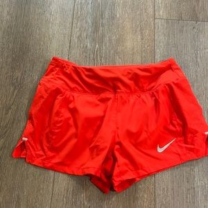 Nike red running shorts
